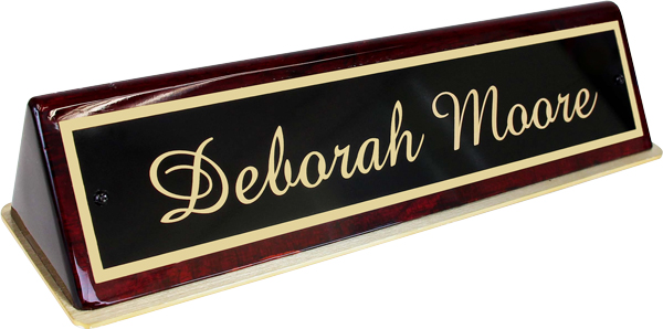 Brass plate and polished wood base makes this nameplate a favorite of lawyers, bankers and high-end offices.
