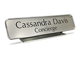 Engraved nameplates are available with a brass or silver - aluminum desk holder.